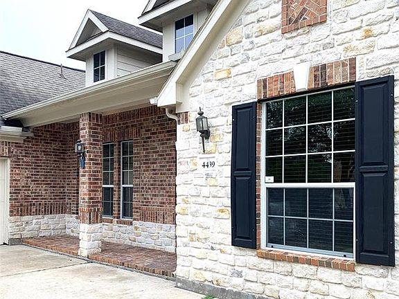 The covered front covered porch is perfect for rocking chairs, plants or perfect holiday decor