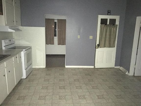 Kitchen - Has a new floor, entry door and cabinets. Plenty of space for a dinning/kitchen table.