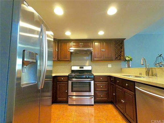 Kitchen with stove and refrigerator