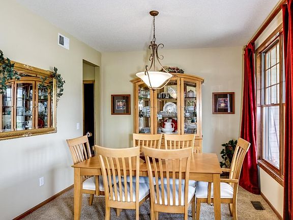 Front dining area with oversized window and pass thru to kitchen.