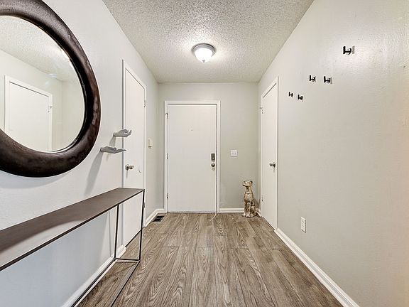 Entryway with supply closet, hot water closet.