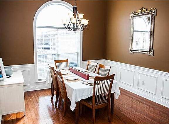 The foyer, dining room and family room are very open to one another. The wall colors are excellent c