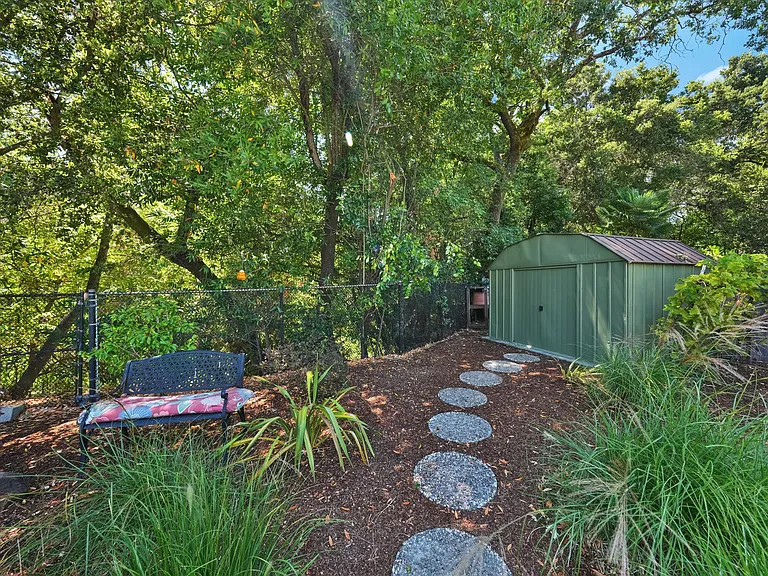 Rear of property (seasonal creek behind fence).