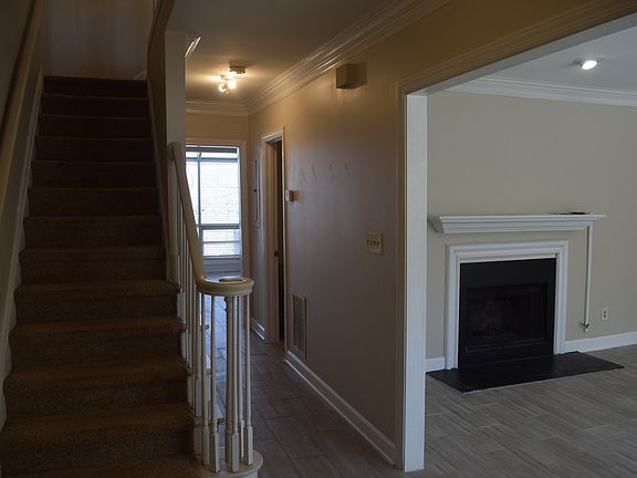 Foyer, hallway to dining/solarium, living room on right