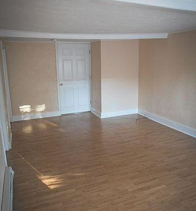 Livingroom. Door seen is to Bedroom #2. Kitchen back and to the left.