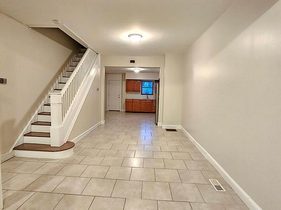 Open floor plan of living room, dining room, and kitchen