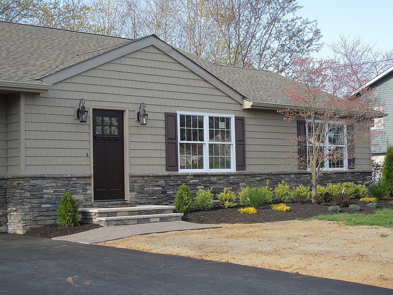 Exterior Front : New Cultured Stone , Ceder Impressions Siding, Windows and Doors