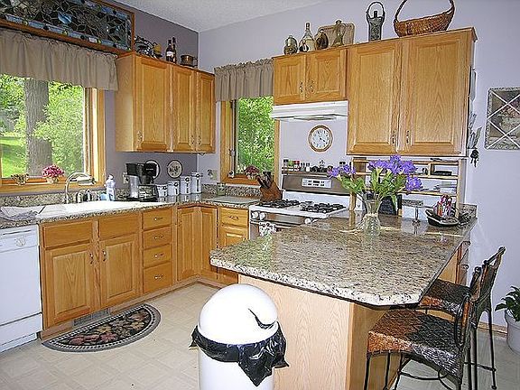 Vaulted ceiling with skylights and granite in Kitchen