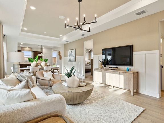Spacious gathering room with tray ceiling model representation