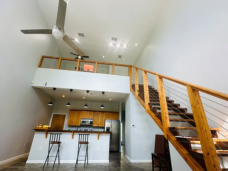 View from downstairs to second floor loft