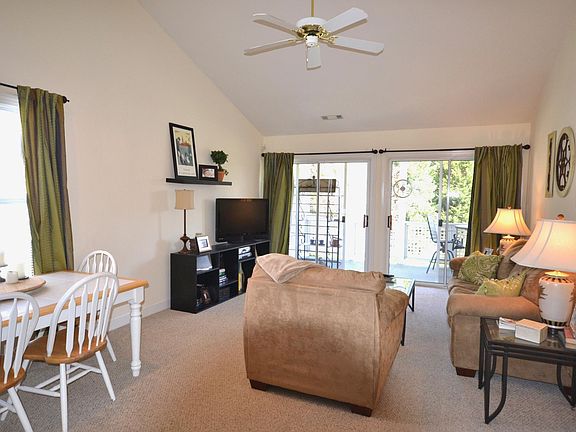 Living area open into the kitchen and porch