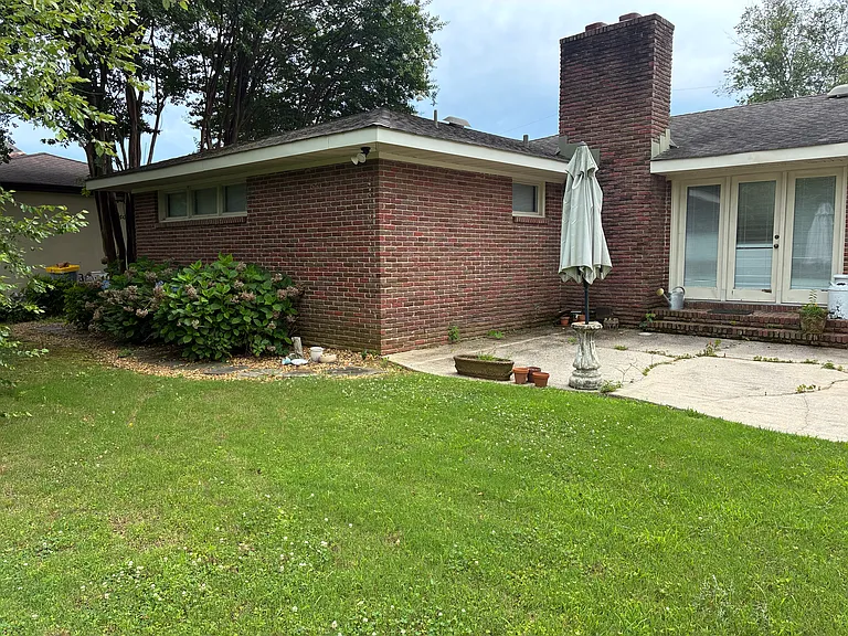Back porch, flat allowing easy walking access to backyard.