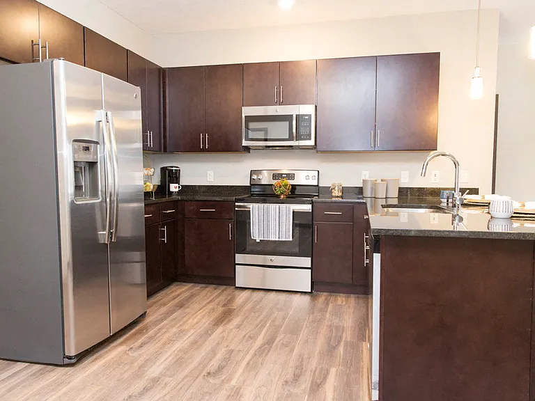 Enjoy preparing meals in your modern kitchen, designed for both functionality and style to enhance your daily routine.