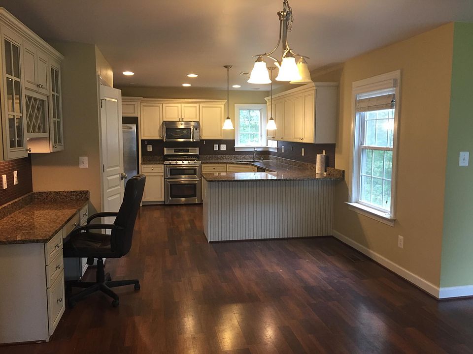 Custom kitchen with granite countertops and stainless steel