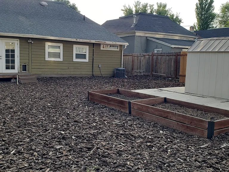 Doggie door installed in back mudroom. Planter boxes available for summer gardening. Yard is ready for your picnic table, BBQ grill, and a casual game of corn hole!