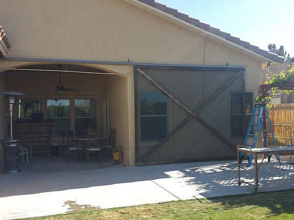 Patio with custom barn door 