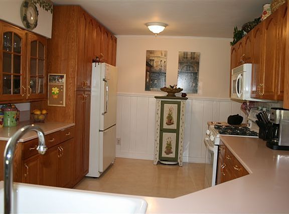 KITCHEN, GAS STOVE, BUILT IN MICROWAVE, DISHWASHER, OAK CABINETS DOOR TO DECK