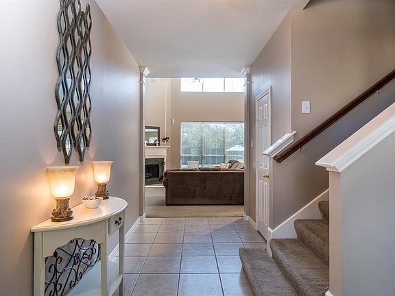 Step inside and instantly feel the warmth of this home! Ceramic tile flooring flows through the entryway into the formal dining room and kitchen!