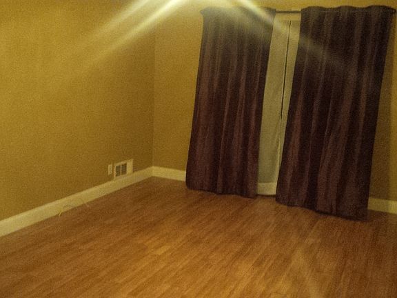 Master Bedroom with a sliding Glass door going to a covered