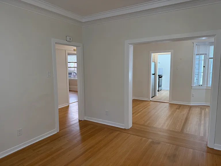 from the back of the living room looking towards the dining room and kitchen beyond that