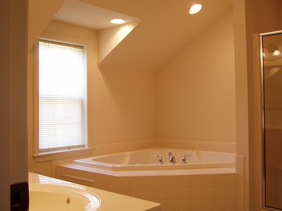 Main bath with whirlpool tub, shower and double vanity