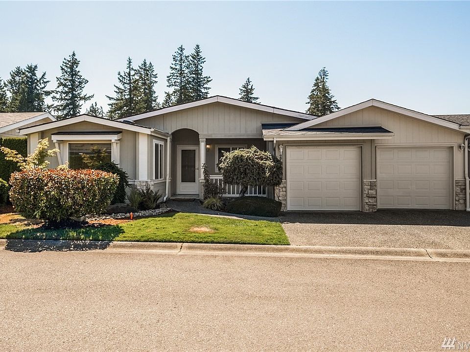 Front view of the condo style rambler with a 2 car garage