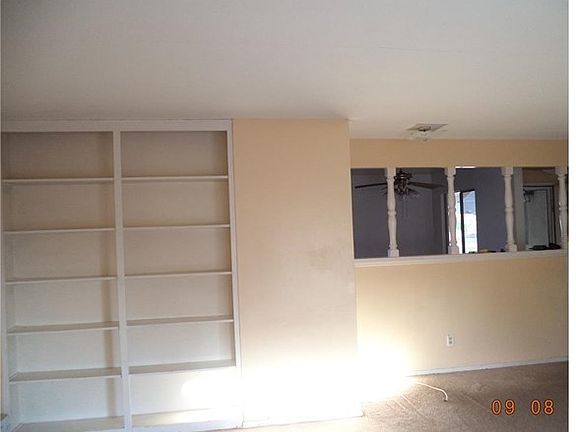 Living room/family room with built in shelves.