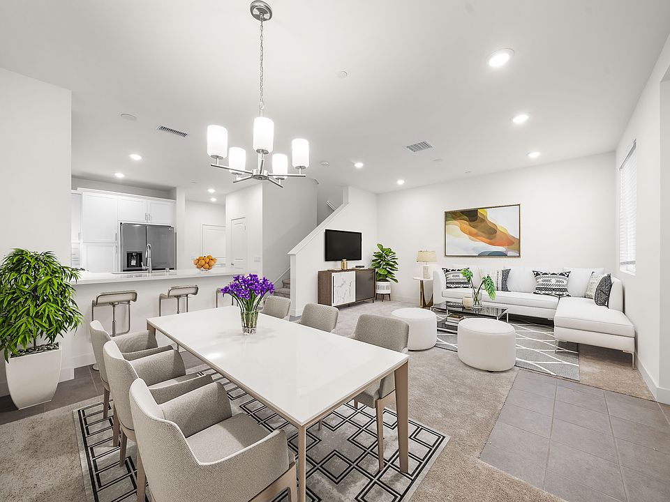 Digitally staged furniture. Spacious Living room on the 1st level.