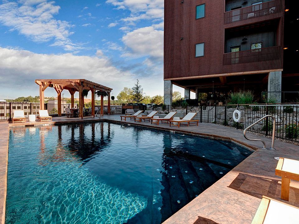 Unwind in luxury at Quarry Town Apartments, featuring a stunning pool and relaxing cabanas. Enjoy a vibrant community with modern amenities and breathtaking views. Schedule your tour today to find your ideal home!