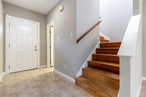 Front entry with a small powder bath on first level.