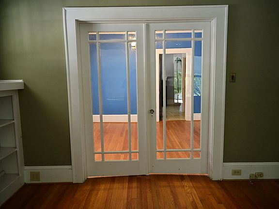 French doors leading from living room into dining room.
