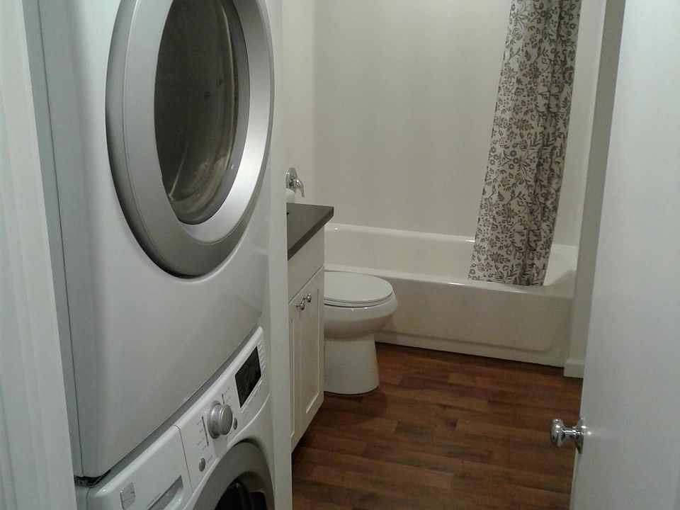 Studio has private stack washer dryer in unit.