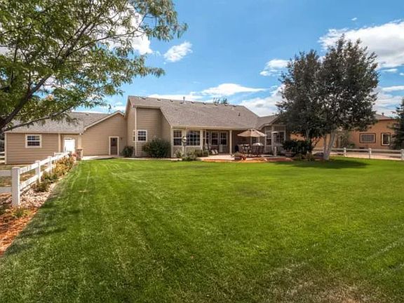 Back of home & backyard. Potential for rent reduction if lawn maintenance and snow removal services are provided to assist homeowners.