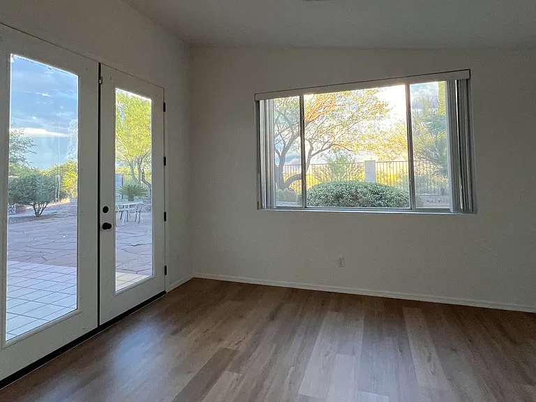 Master bedroom window and French door to backyard.