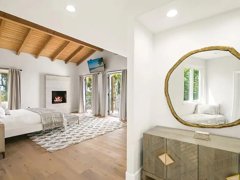 Open master bedroom with a large patio to step onto and admire the ocean views.