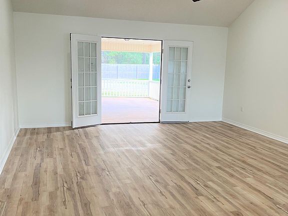 living room with french doors leading to back patio
