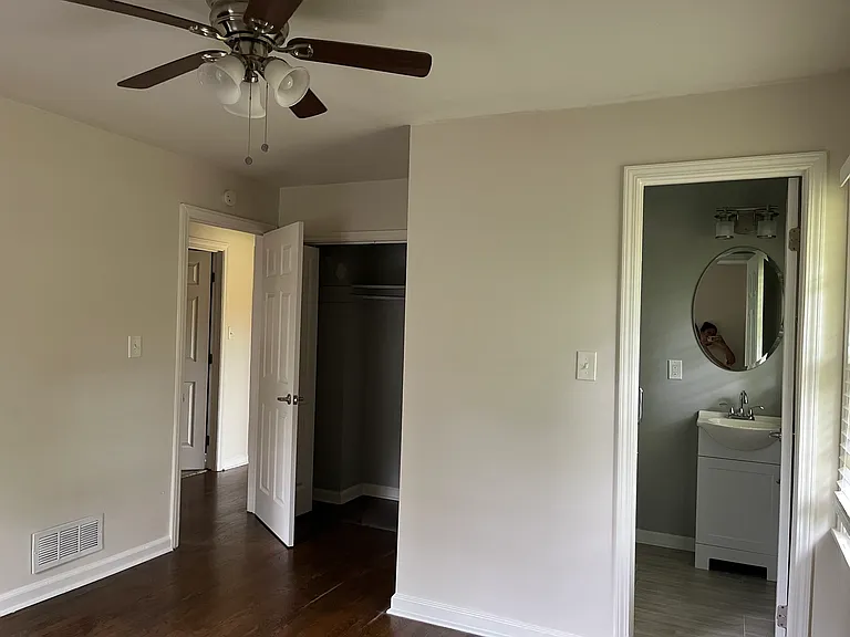 Primary bedroom with private full bathroom and closet