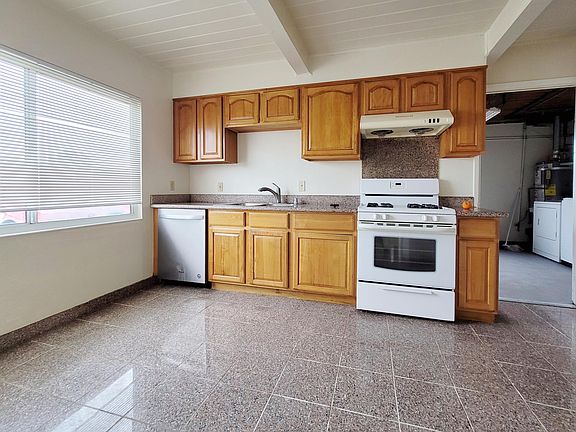 Kitchen, next to the garage, and able to access the backyard