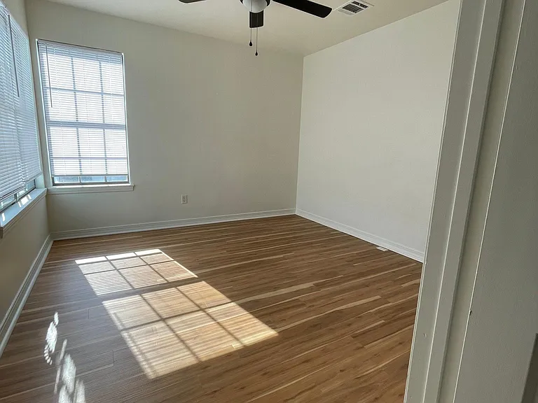 Bedroom with new flooring and new fan/ lighting & blinds
