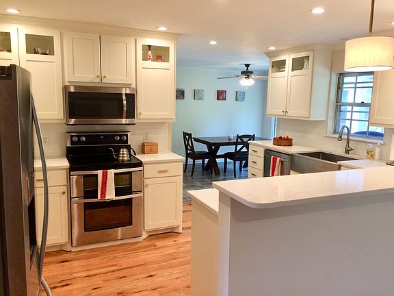 Kitchen leading into breakfast room (note: piano is now in the place of this table)
