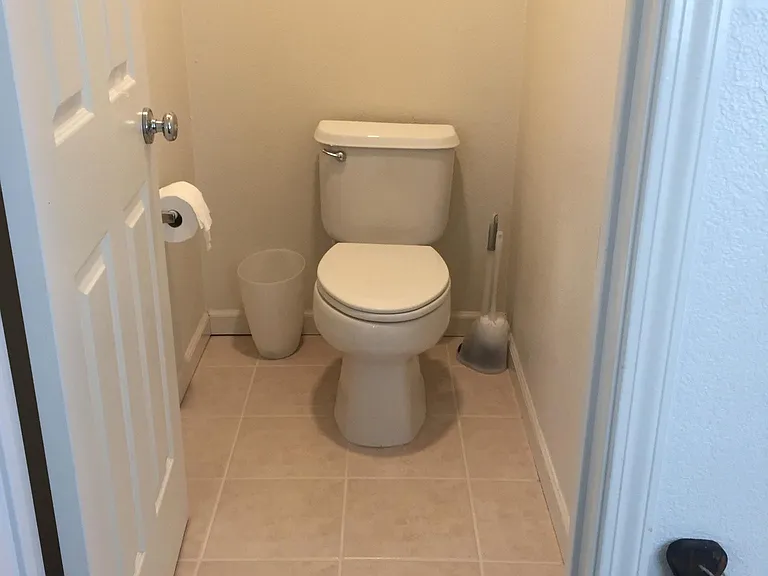 Toilet room in the master bathroom area. The High Efficiency Elongated Toilet was installed in 2019.