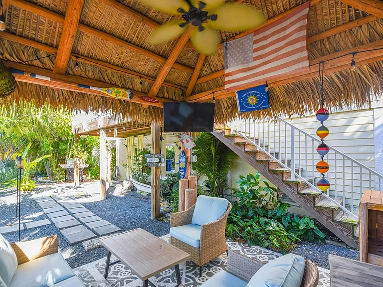 Covered patio area with outdoor seating