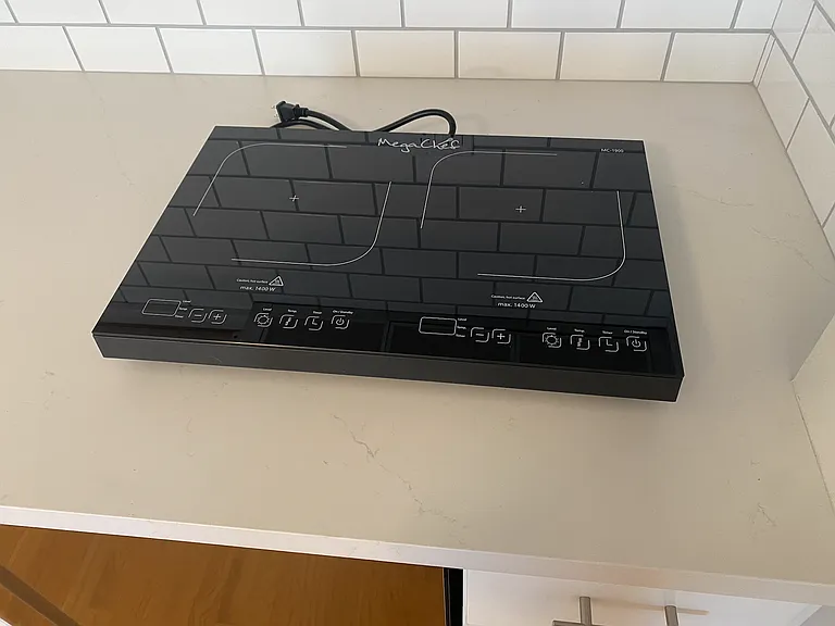 Convection cooktop, can stow in cabinet under counter when not in use.