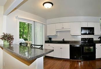New, new, New! From the cabinets to the floor and even the counter tops, this kitchen is ready to be used. Another brand new slider door was just installed that leads out to the huge deck over looking the spacious back yard. 