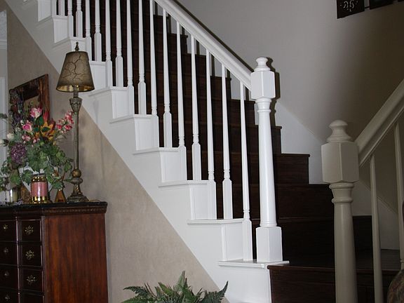 20x20 porcelain tile with granite and slate inserts - updated with hardwoods.