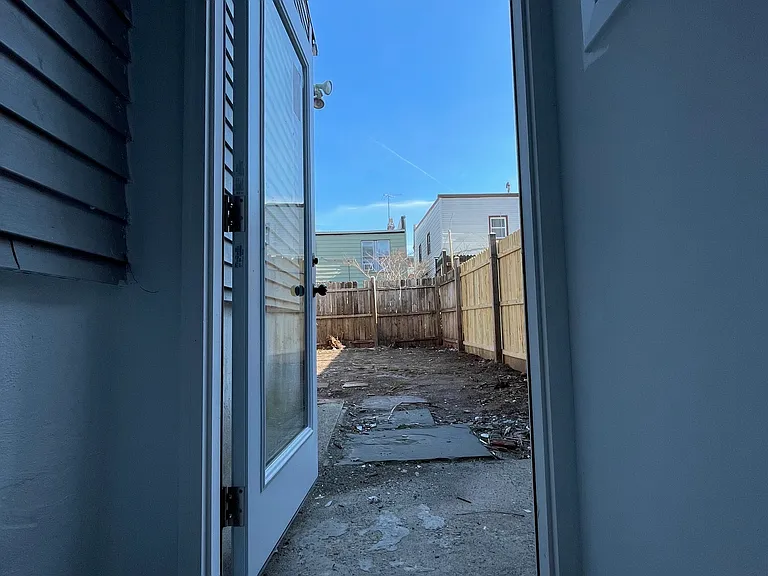 door from garden level opening to the backyard