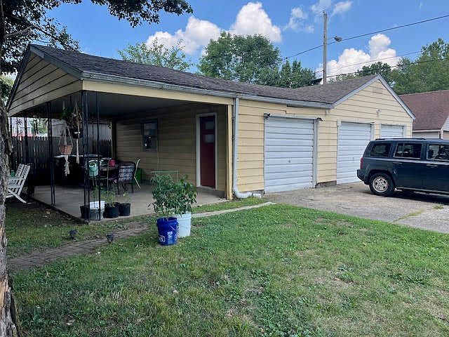 Shared patio area and detached 3-car garage.