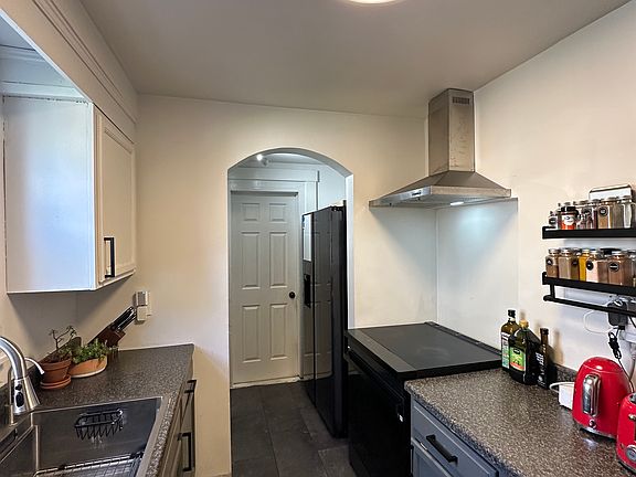Kitchen _ Appliances included: dishwasher, oven, and fridge; microwave is located in the pantry. Other items shown are for display only; unit is rented unfurnished.