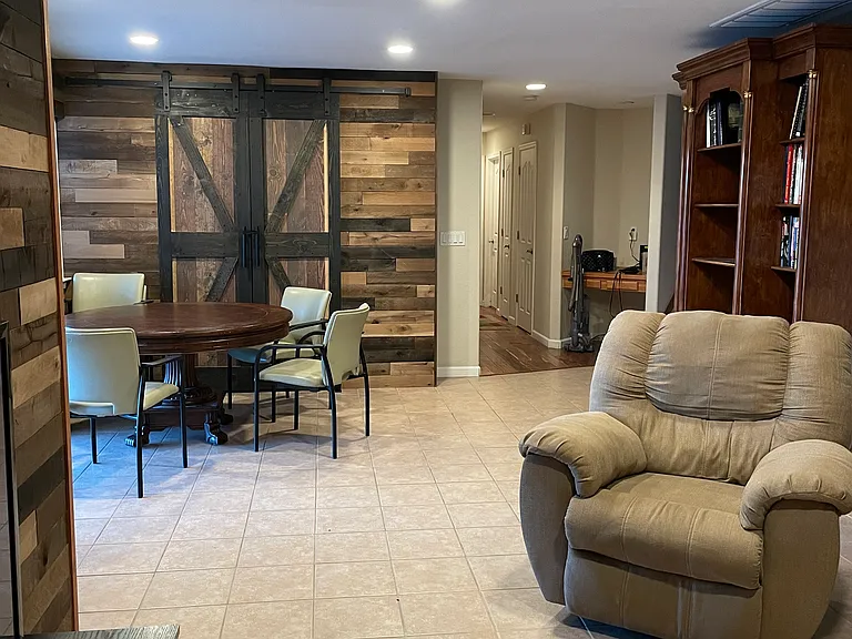 View from den to hallway. Room is on the left, door to backyard also on the left and bathroom is on the left in the hallway.