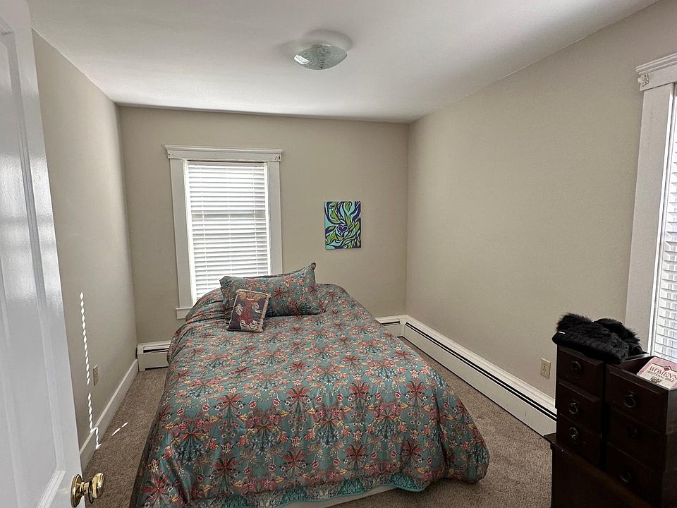 View of rear bedroom off the kitchen. Furnishings not included.